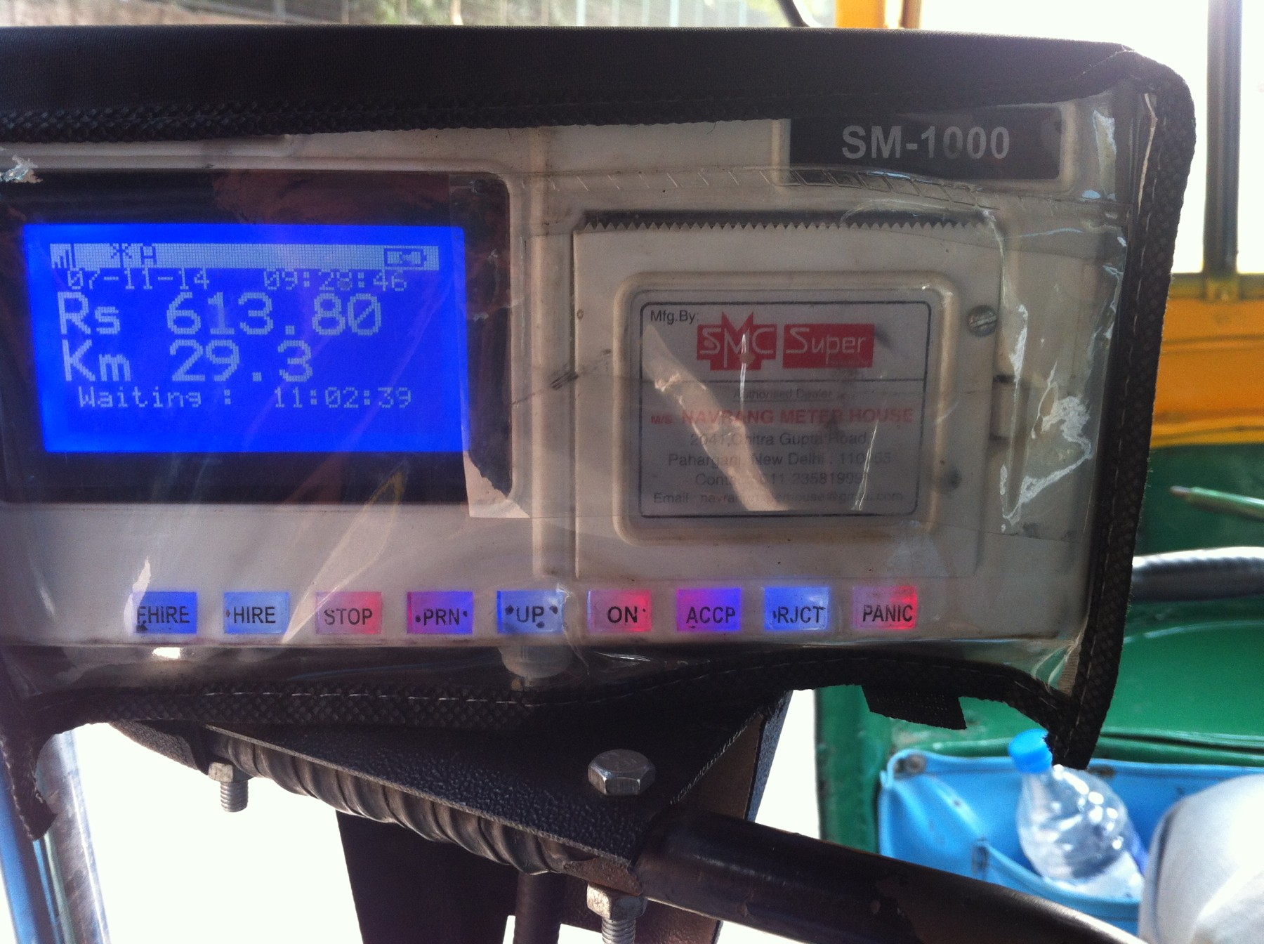 The panic button on a meter in a Delhi auto rickshaw when pressed a distress should be routed to the nearest police station (far right).